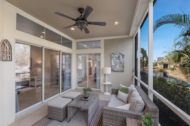 8045 Tybee Ct Unit 8045, University Park, FL 34201 - sunroom featuring an outdoor hangout area, a ceiling fan, a water view, and recessed lighting