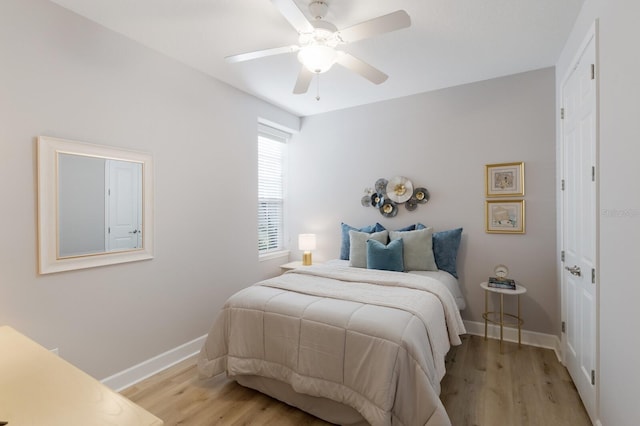 8045 Tybee Ct Unit 8045, University Park, FL 34201 - bedroom featuring baseboards, ceiling fan, and light wood-style floors