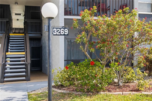 view of exterior entry featuring stucco siding