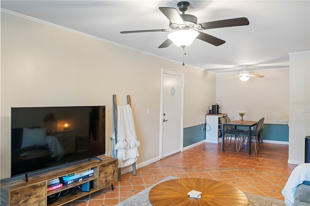 tiled living room with a ceiling fan, baseboards, and crown molding