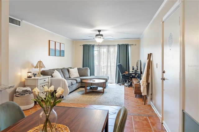 living room with visible vents, a ceiling fan, light tile patterned floors, crown molding, and baseboards