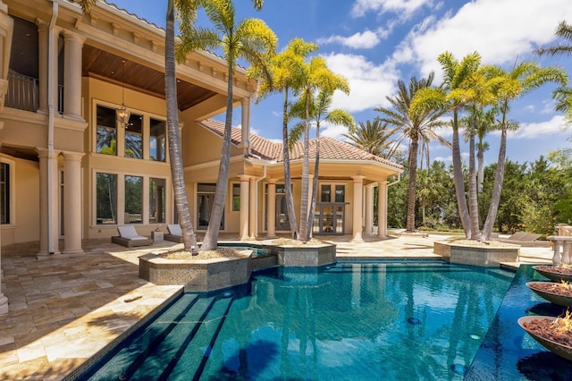 outdoor pool featuring a patio area