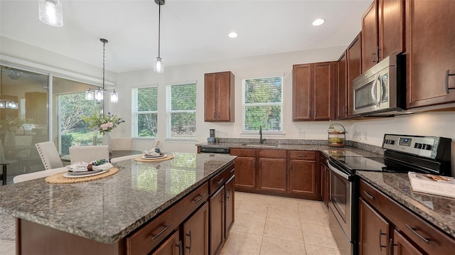 11847 Meadowgate Pl, Lakewood Ranch, FL 34211 - kitchen with dark stone countertops, stainless steel appliances, and a sink