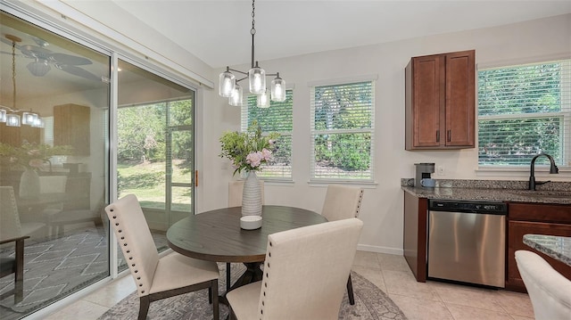 11847 Meadowgate Pl, Lakewood Ranch, FL 34211 - dining area with light tile patterned floors, ceiling fan with notable chandelier, baseboards, and plenty of natural light