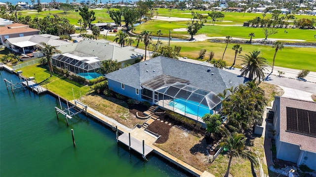621 Ivanhoe Ln, Holmes Beach, FL 34217 - drone / aerial view with view of golf course, a water view, and a residential view