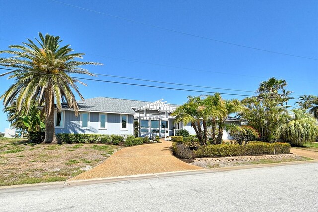 621 Ivanhoe Ln, Holmes Beach, FL 34217 - ranch-style house featuring a pergola