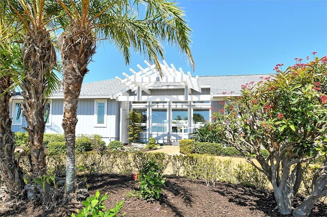 621 Ivanhoe Ln, Holmes Beach, FL 34217 - rear view of house with a pergola