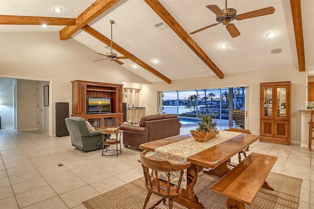 621 Ivanhoe Ln, Holmes Beach, FL 34217 - dining space with ceiling fan, beam ceiling, visible vents, and light tile patterned floors