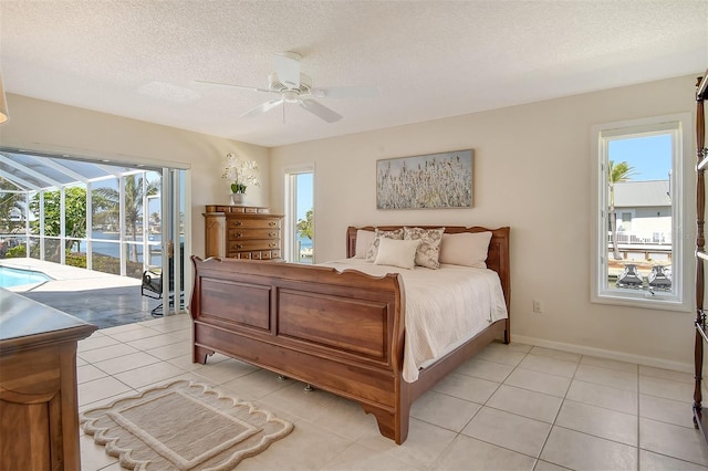 621 Ivanhoe Ln, Holmes Beach, FL 34217 - bedroom featuring light tile patterned flooring, multiple windows, ceiling fan, and access to outside