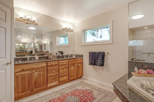 621 Ivanhoe Ln, Holmes Beach, FL 34217 - full bath featuring a garden tub, a sink, double vanity, a tile shower, and tile patterned flooring