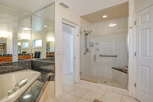 621 Ivanhoe Ln, Holmes Beach, FL 34217 - full bathroom with a shower stall, a bath, tile patterned flooring, and vanity