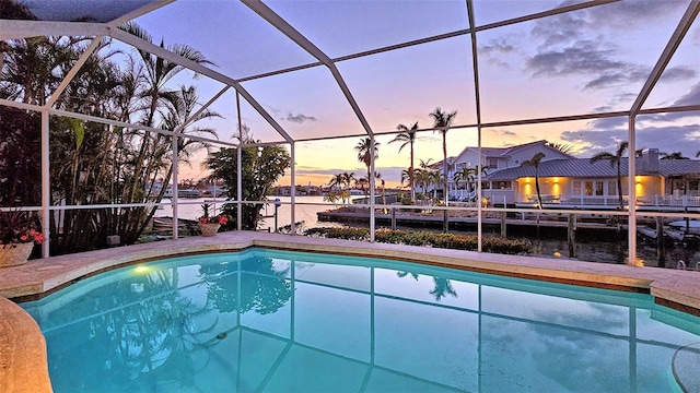 621 Ivanhoe Ln, Holmes Beach, FL 34217 - outdoor pool with glass enclosure and a water view