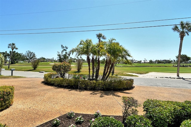 621 Ivanhoe Ln, Holmes Beach, FL 34217 - view of home's community featuring a yard and view of golf course