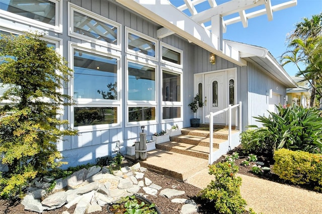 621 Ivanhoe Ln, Holmes Beach, FL 34217 - view of exterior entry with board and batten siding