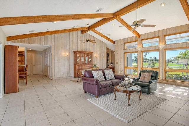 621 Ivanhoe Ln, Holmes Beach, FL 34217 - living room with wood walls, a ceiling fan, light tile patterned floors, beam ceiling, and high vaulted ceiling