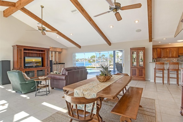 621 Ivanhoe Ln, Holmes Beach, FL 34217 - dining area featuring beam ceiling, visible vents, ceiling fan, high vaulted ceiling, and light tile patterned floors