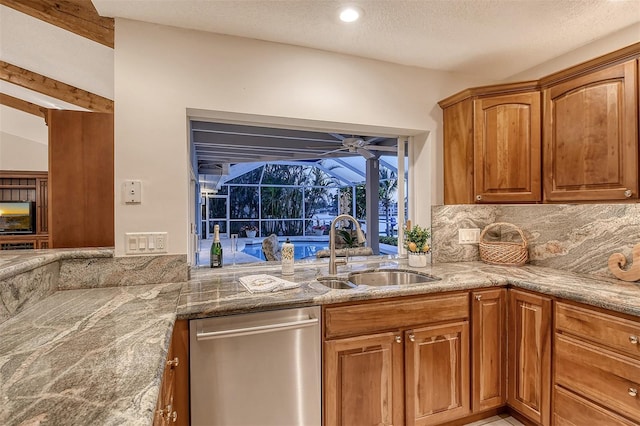 621 Ivanhoe Ln, Holmes Beach, FL 34217 - kitchen with stainless steel dishwasher, a sink, light stone counters, and tasteful backsplash