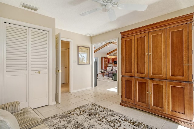 621 Ivanhoe Ln, Holmes Beach, FL 34217 - corridor with baseboards, visible vents, and light tile patterned floors