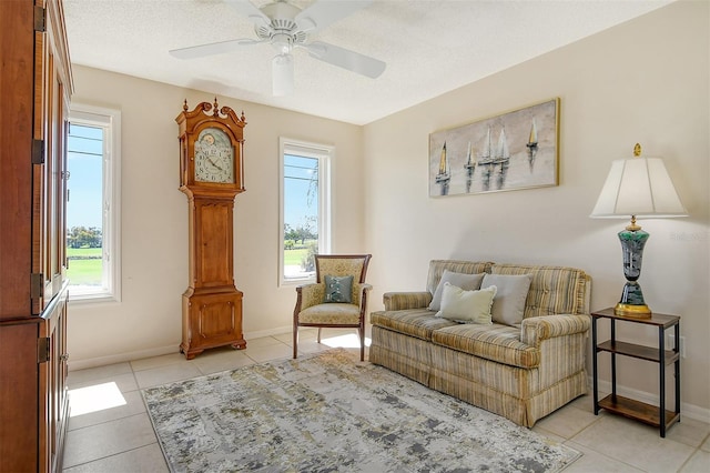 621 Ivanhoe Ln, Holmes Beach, FL 34217 - living area featuring plenty of natural light, baseboards, light tile patterned floors, and ceiling fan