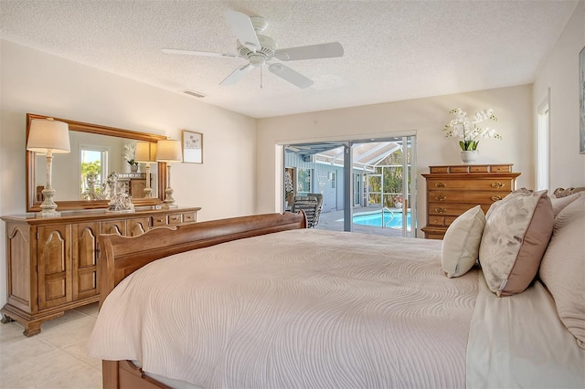 621 Ivanhoe Ln, Holmes Beach, FL 34217 - bedroom featuring a ceiling fan, a textured ceiling, access to outside, a sunroom, and visible vents