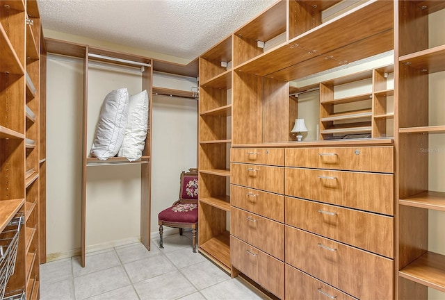 621 Ivanhoe Ln, Holmes Beach, FL 34217 - walk in closet with light tile patterned floors