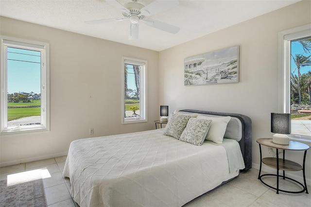 621 Ivanhoe Ln, Holmes Beach, FL 34217 - bedroom with a ceiling fan, baseboards, and light tile patterned flooring