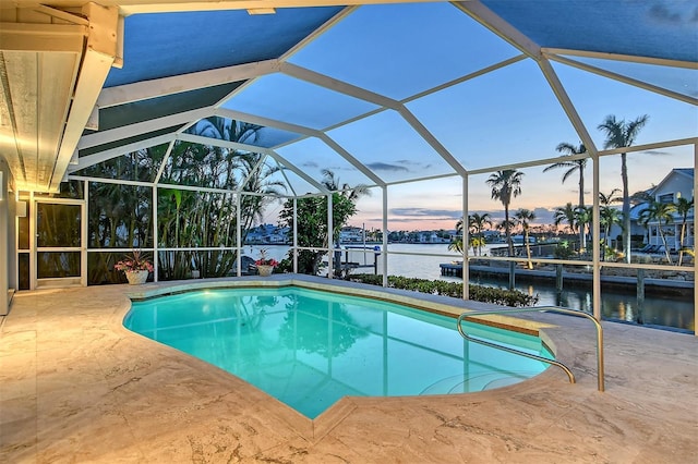 621 Ivanhoe Ln, Holmes Beach, FL 34217 - pool featuring glass enclosure, a patio area, a boat dock, and a water view
