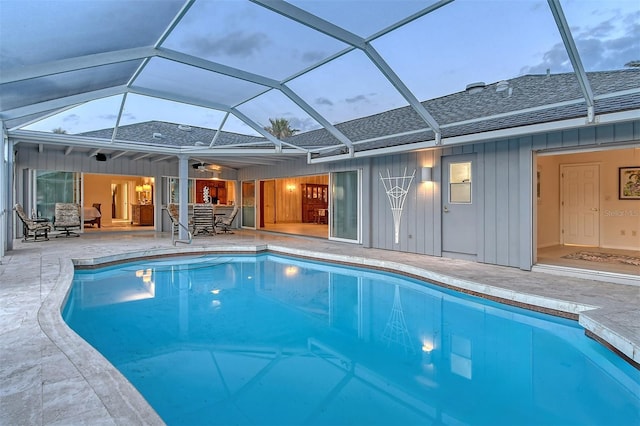 621 Ivanhoe Ln, Holmes Beach, FL 34217 - pool with a patio area, a ceiling fan, and glass enclosure