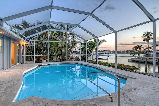 621 Ivanhoe Ln, Holmes Beach, FL 34217 - outdoor pool featuring a patio, glass enclosure, and a water view