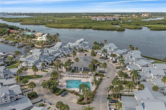 bird's eye view with a water view and a residential view