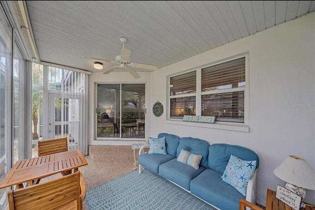 sunroom / solarium with an outdoor living space and ceiling fan