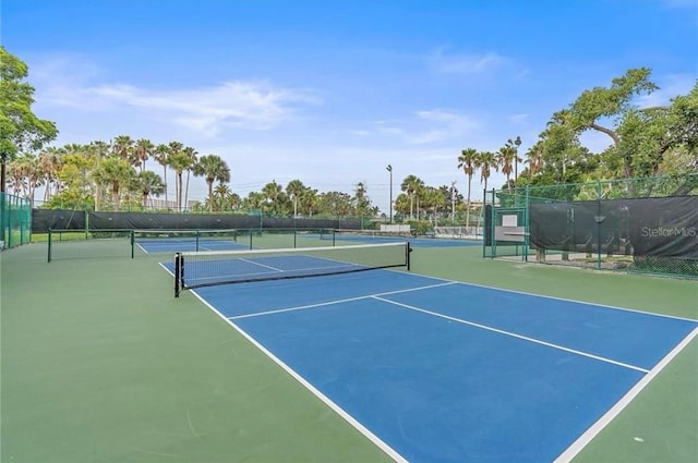 view of sport court with community basketball court and fence