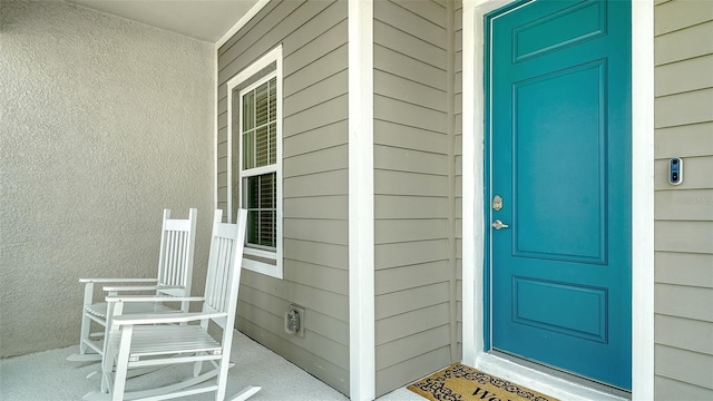 doorway to property with covered porch