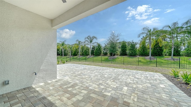 view of patio / terrace featuring view of wooded area