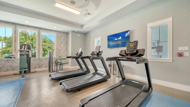 exercise room with baseboards and recessed lighting