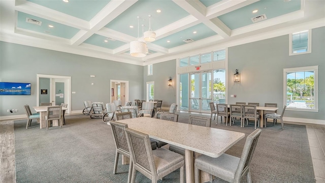 carpeted dining room featuring a high ceiling, plenty of natural light, coffered ceiling, beam ceiling, and baseboards