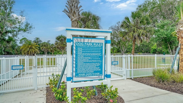 surrounding community featuring fence and a gate