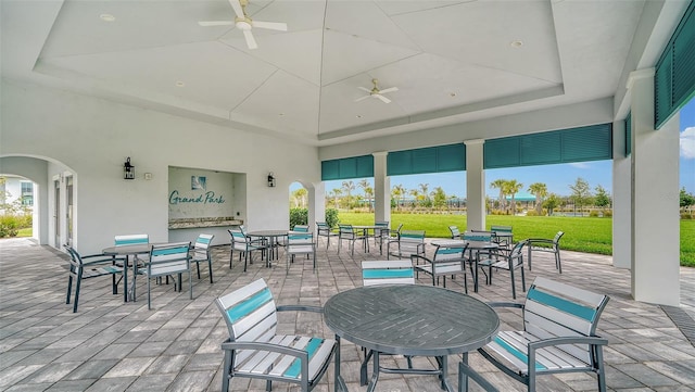 view of patio with ceiling fan and outdoor dining area