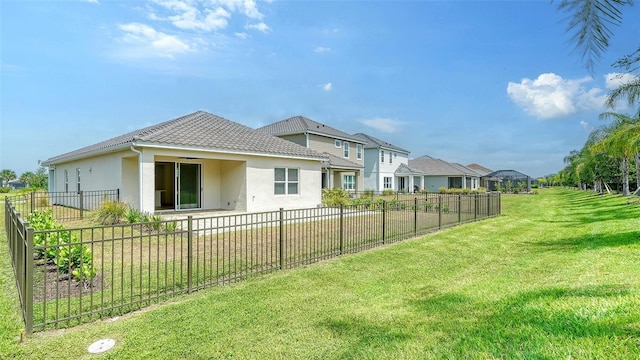 10105 Canaveral Cir, Sarasota, FL 34241 - rear view of property featuring stucco siding, a tiled roof, and a residential view