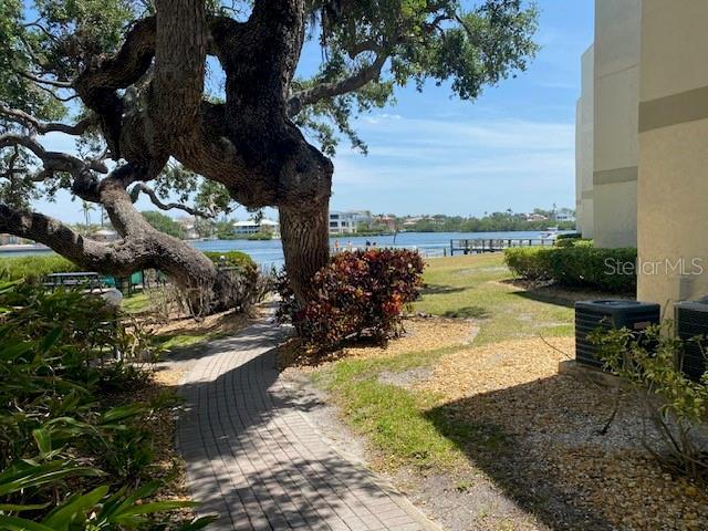 6157 E Midnight Pass Rd Unit B51, Sarasota, FL 34242 - view of green lawn featuring a water view and central AC