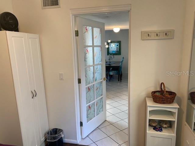6157 E Midnight Pass Rd Unit B51, Sarasota, FL 34242 - entryway featuring light tile patterned floors
