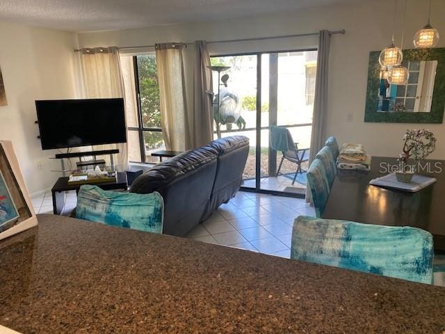 6157 E Midnight Pass Rd Unit B51, Sarasota, FL 34242 - living room with tile patterned flooring