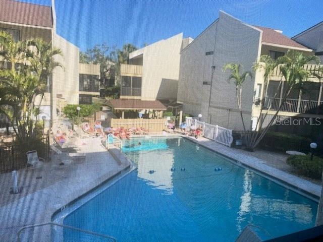 6157 E Midnight Pass Rd Unit B51, Sarasota, FL 34242 - community pool featuring a patio