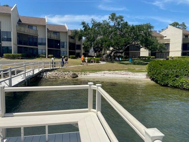 6157 E Midnight Pass Rd Unit B51, Sarasota, FL 34242 - dock featuring a water view