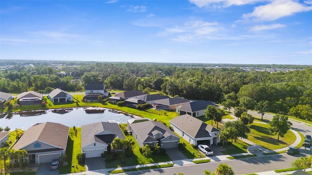 birds eye view of property featuring a water view and a residential view