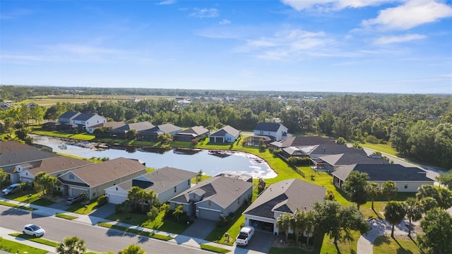 birds eye view of property featuring a residential view and a water view
