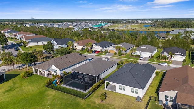 bird's eye view featuring a water view and a residential view