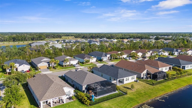 birds eye view of property with a residential view and a water view