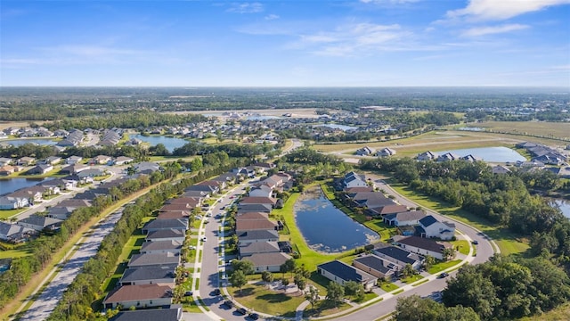 bird's eye view featuring a residential view and a water view