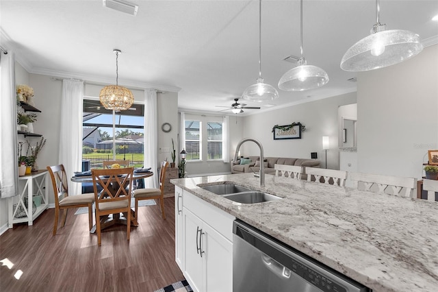 kitchen featuring crown molding, a sink, open floor plan, dishwasher, and visible vents